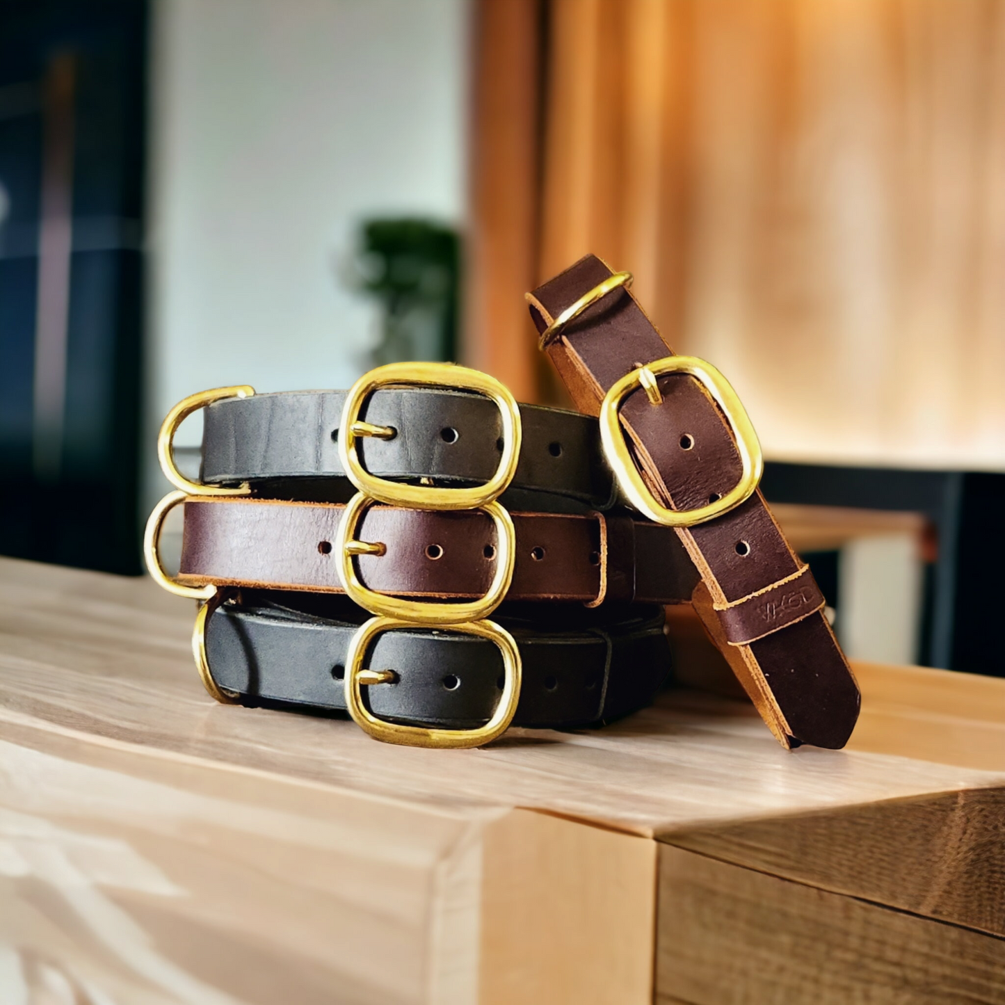 The working or larger, leather dog collar in brass swage buckles