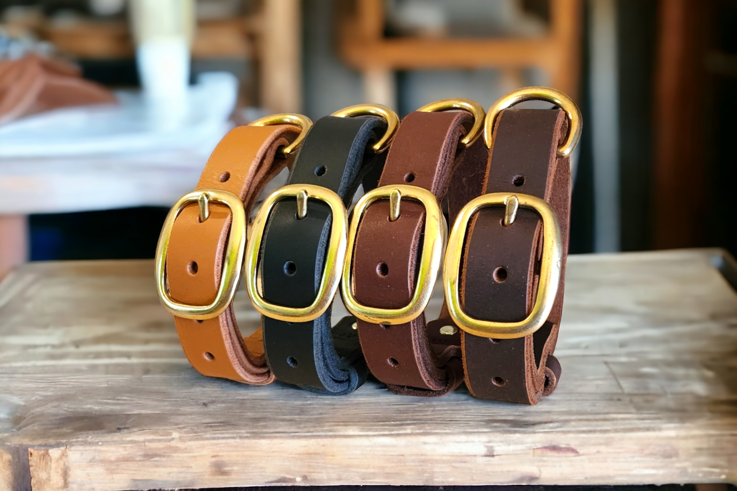 The working or larger, leather dog collar in brass swage buckles